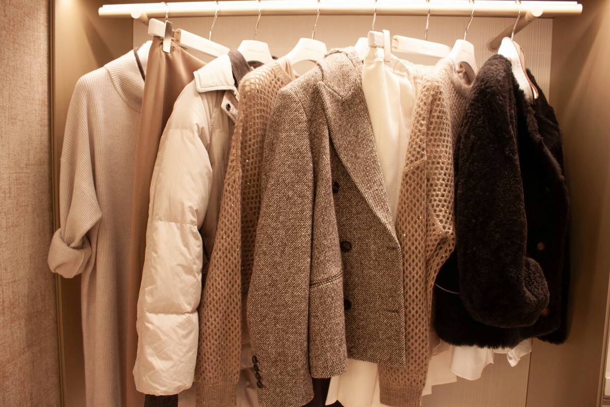 Proper puffer jacket storage on a padded hanger in a dry closet