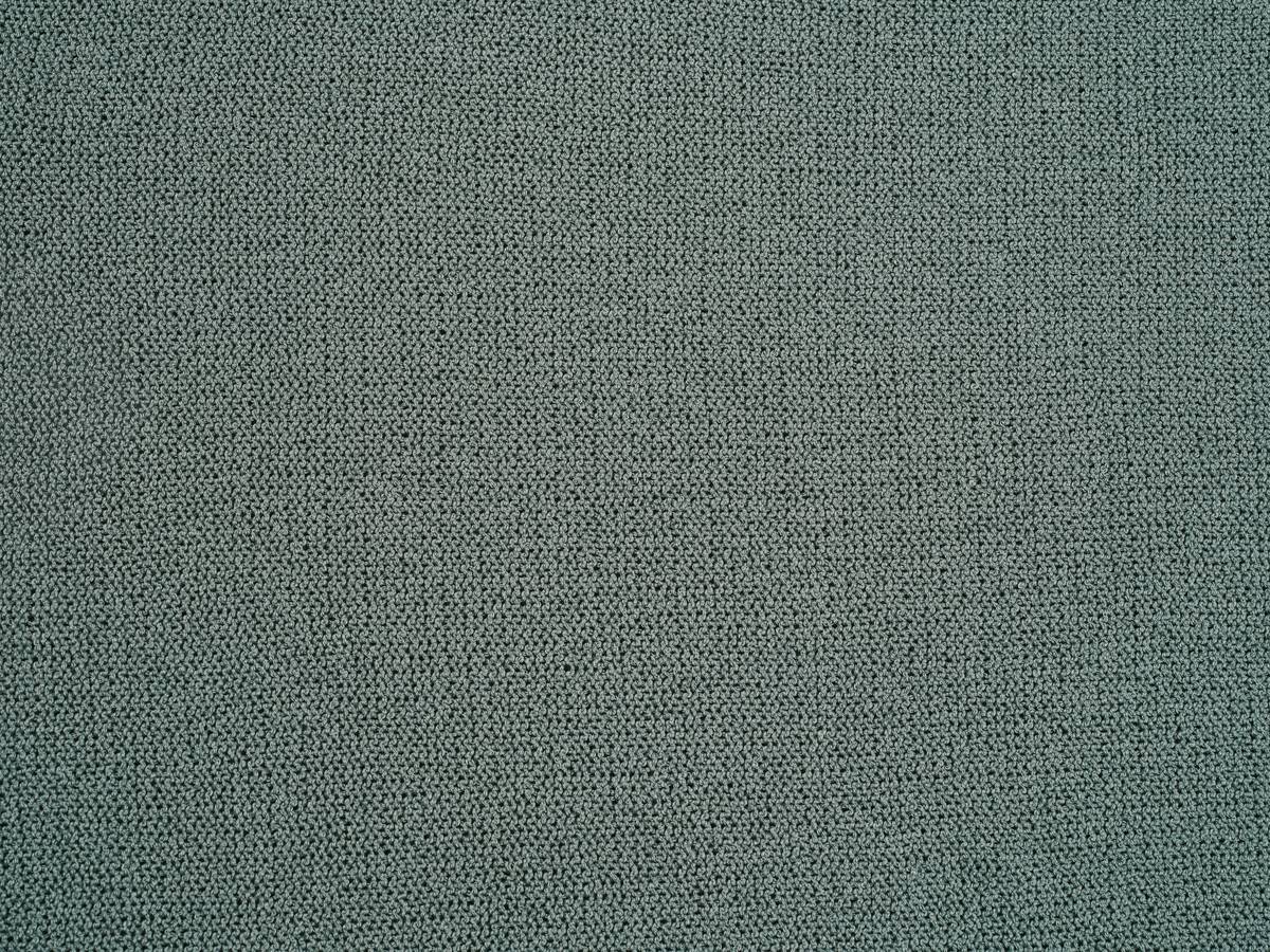 Close-up of high-performance activewear fabric showing moisture-wicking texture, illustrating textiles and technology in action